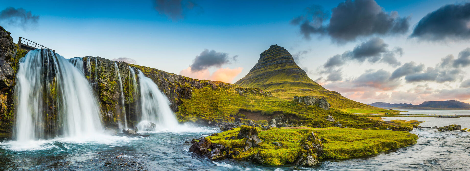 pristine waterfall over mossy green outcrop